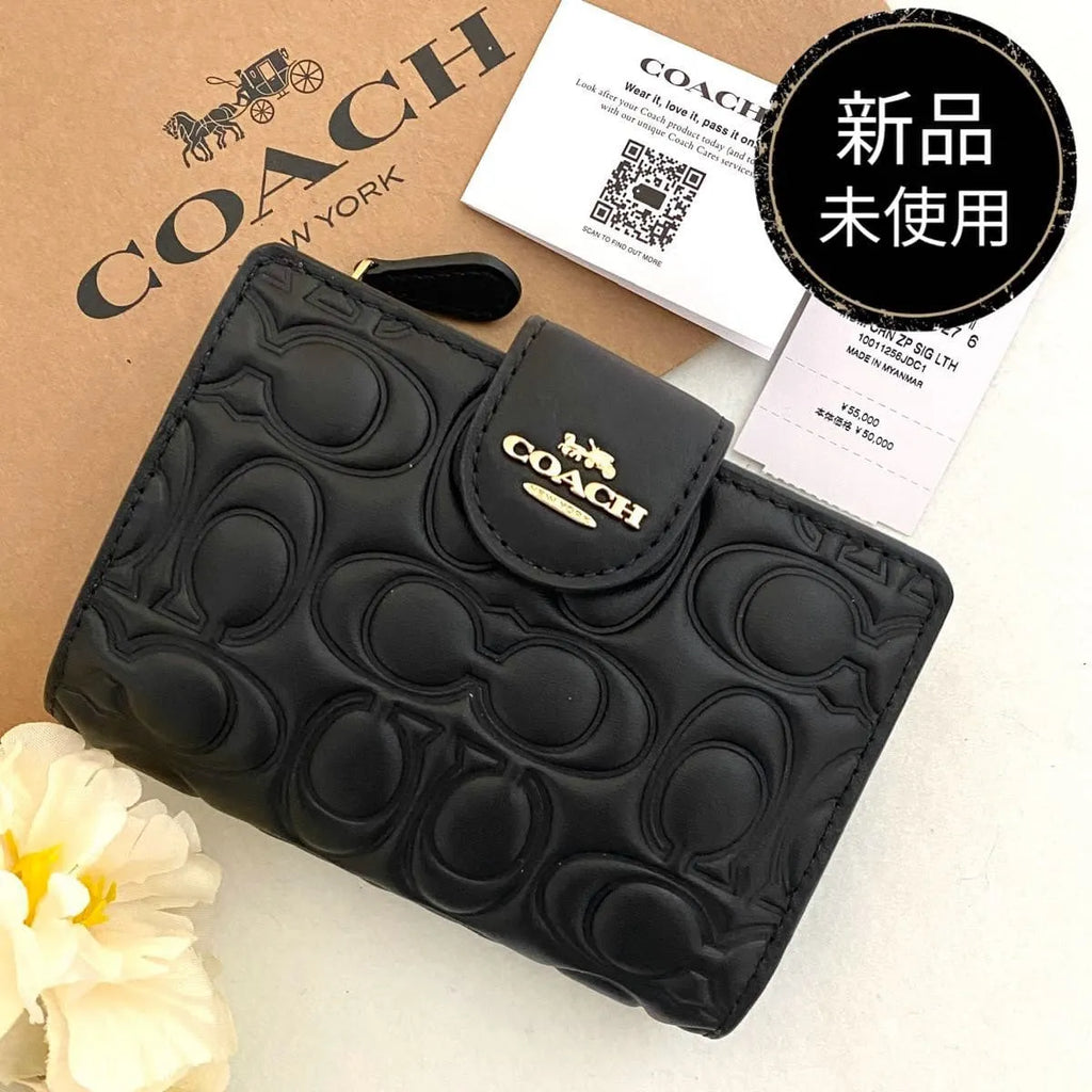 COACH Women’s Signature Embossed Leather Bifold Wallet CZ341