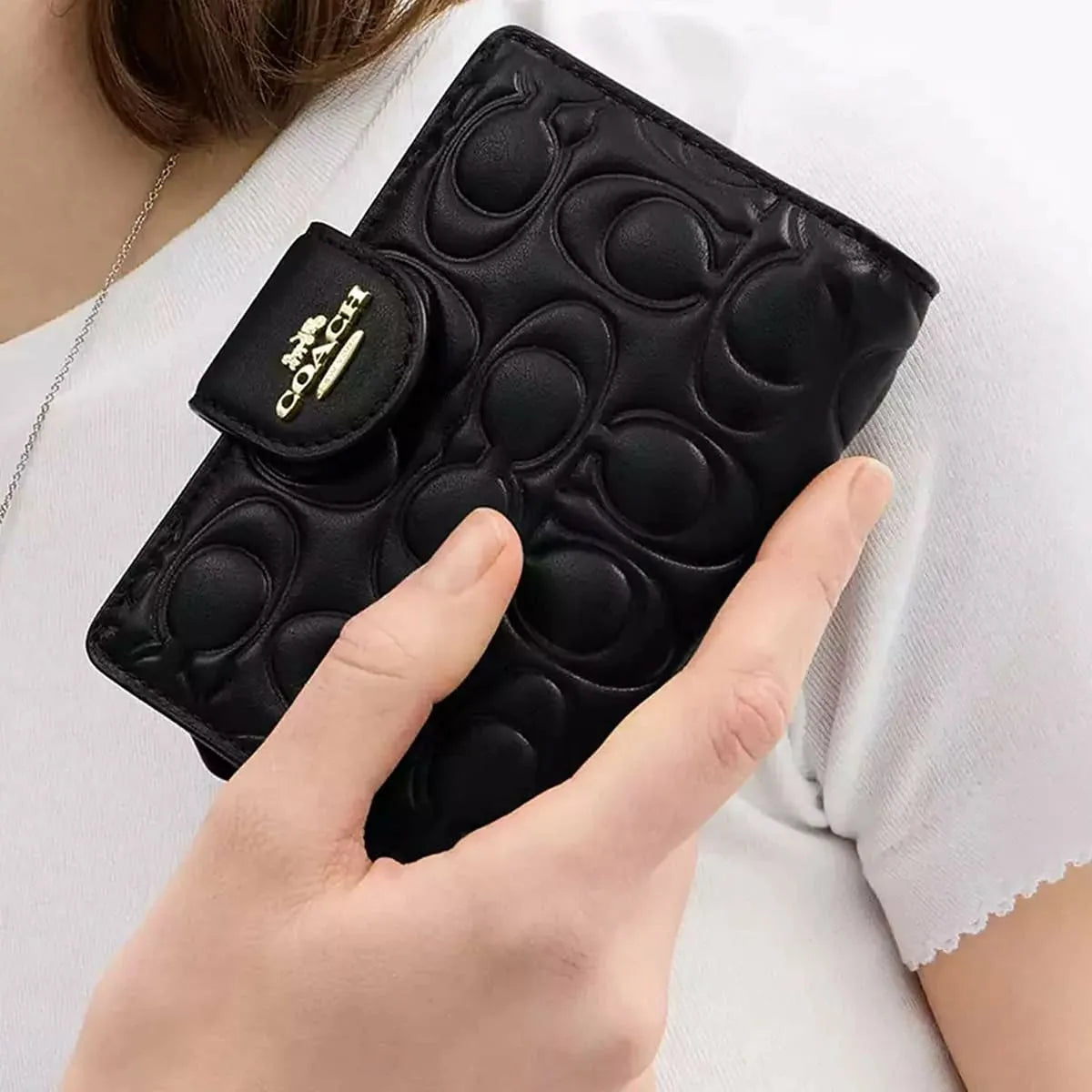COACH Women’s Signature Embossed Leather Bifold Wallet CZ341